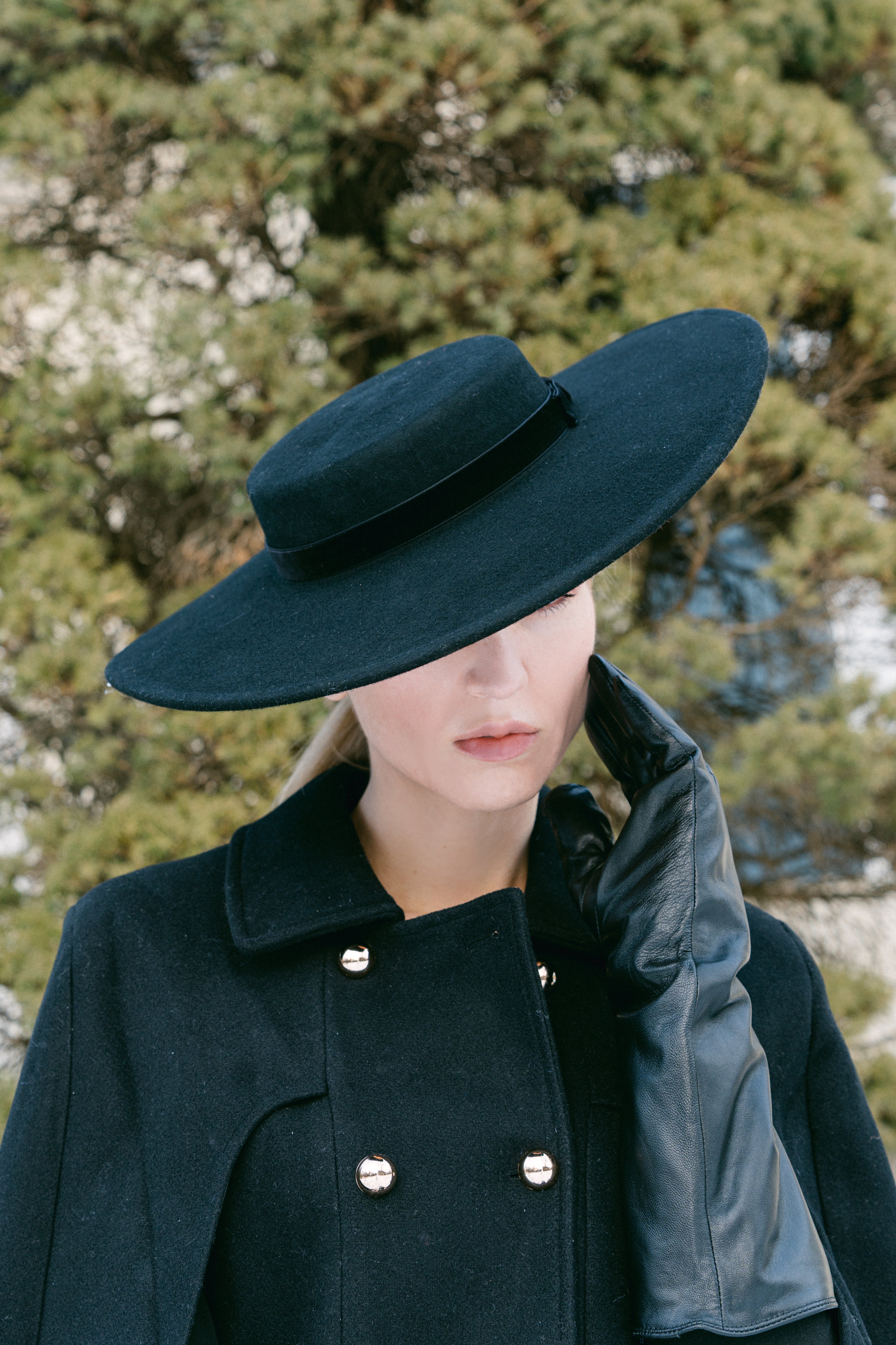 black wide brim hat with tailored coat